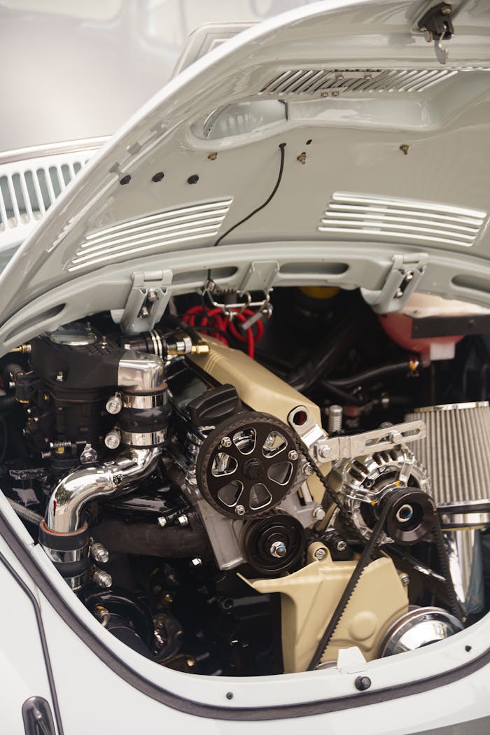 Detailed view of a vintage Volkswagen Beetle's engine in Rio de Janeiro.